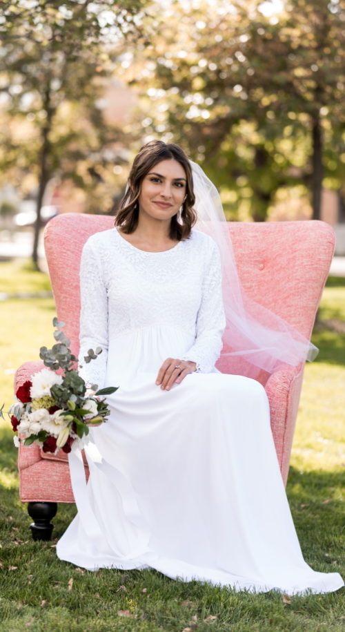 London White Wedding Dress - Bride in Chair - Modest & Affordable