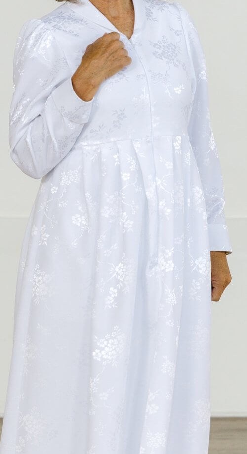 Nagoya Dress – White non-wrinkle LDS Temple dress with a floral jacquard pattern, front zipper, and long sleeves.