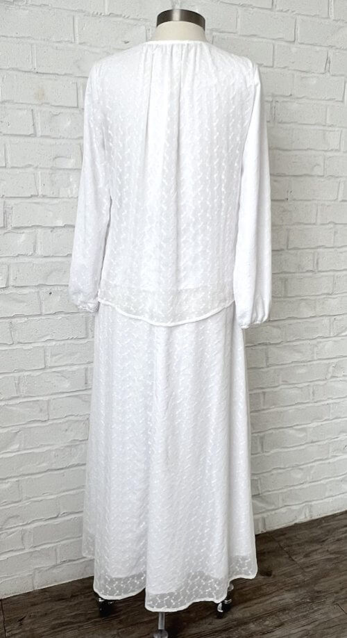 Back view white embroidered LDS Temple blouse with gathered detailing and a flowy A-line skirt.